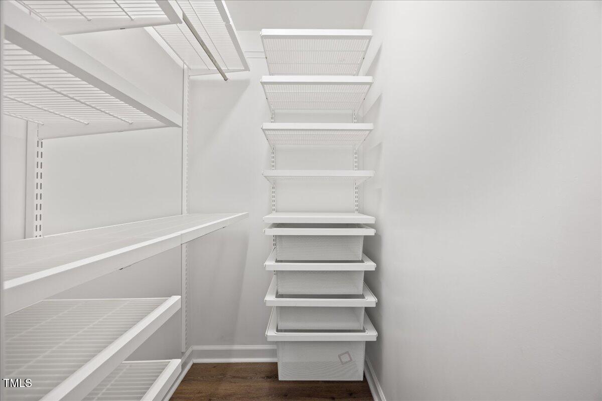 4 Pickard Place Durham, NC 27703 - Photo 37 of 80 a view of walk in closet with empty racks