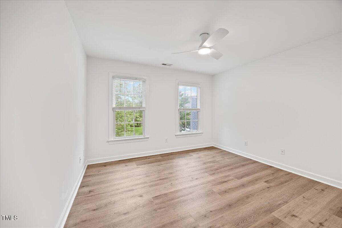 4 Pickard Place Durham, NC 27703 - Photo 38 of 80 an empty room with wooden floor and windows