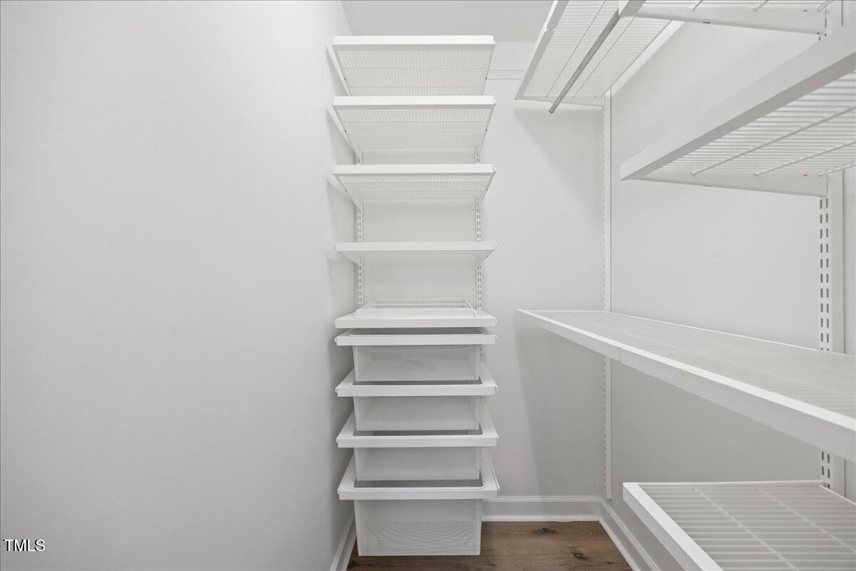 4 Pickard Place Durham, NC 27703 - Photo 40 of 80 a view of walk in closet with empty racks