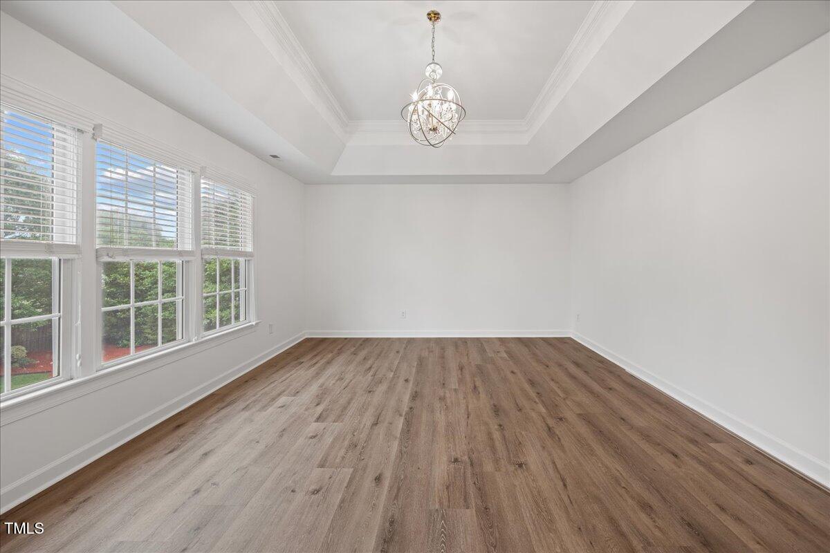 4 Pickard Place Durham, NC 27703 - Photo 43 of 80 an empty room with wooden floor and windows