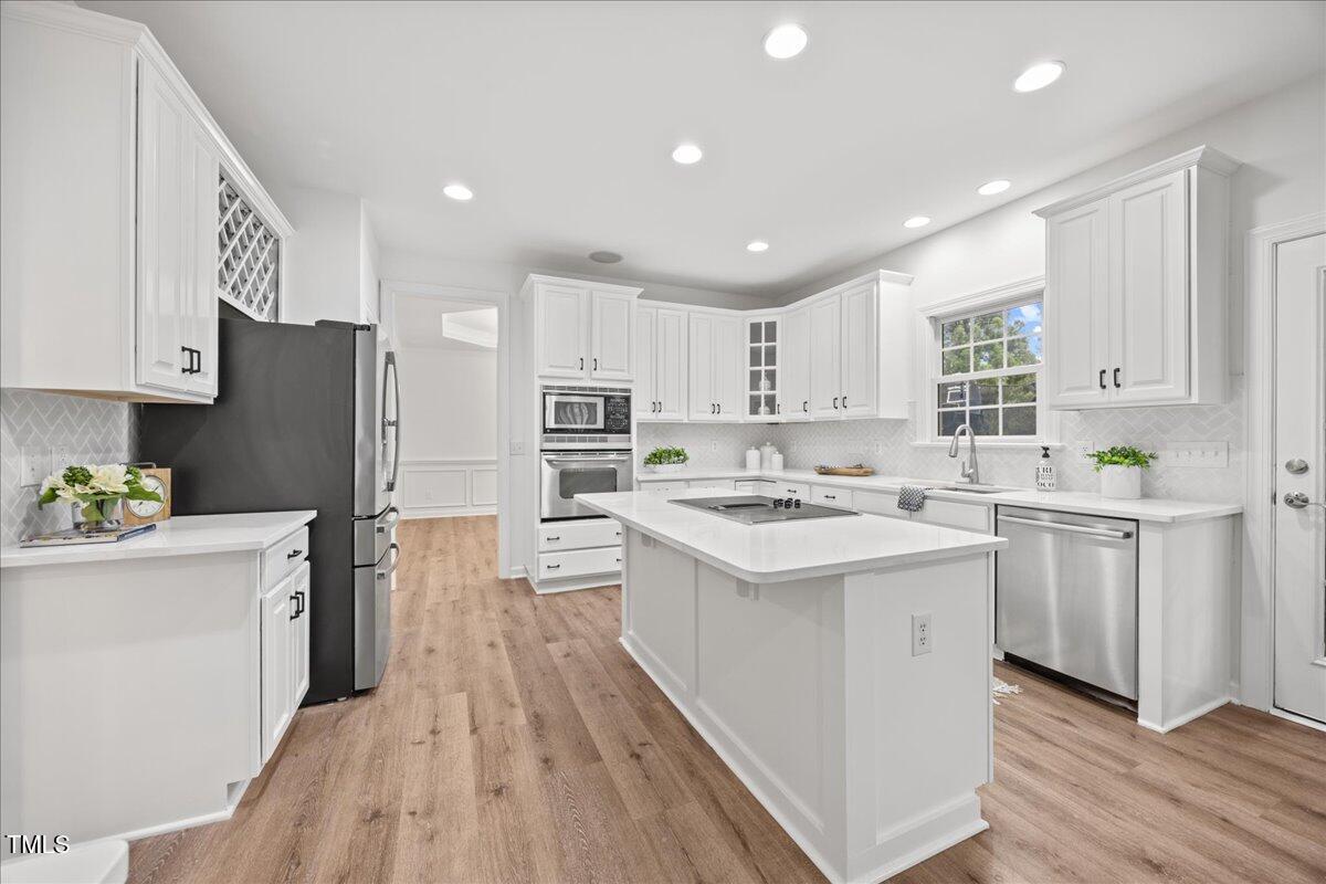 4 Pickard Place Durham, NC 27703 - Photo 9 of 80 a kitchen with white cabinets stove and refrigerator