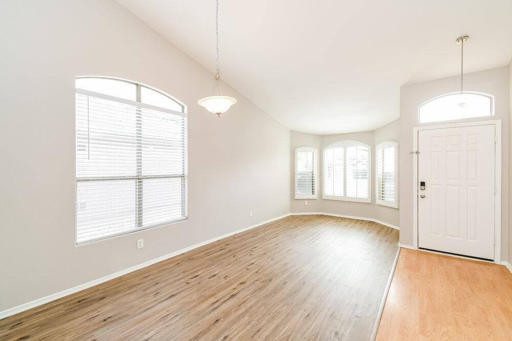 1766 East Tyson Street Gilbert, AZ 85295 - Photo 11 of 17 a view of an empty room with wooden floor and a window