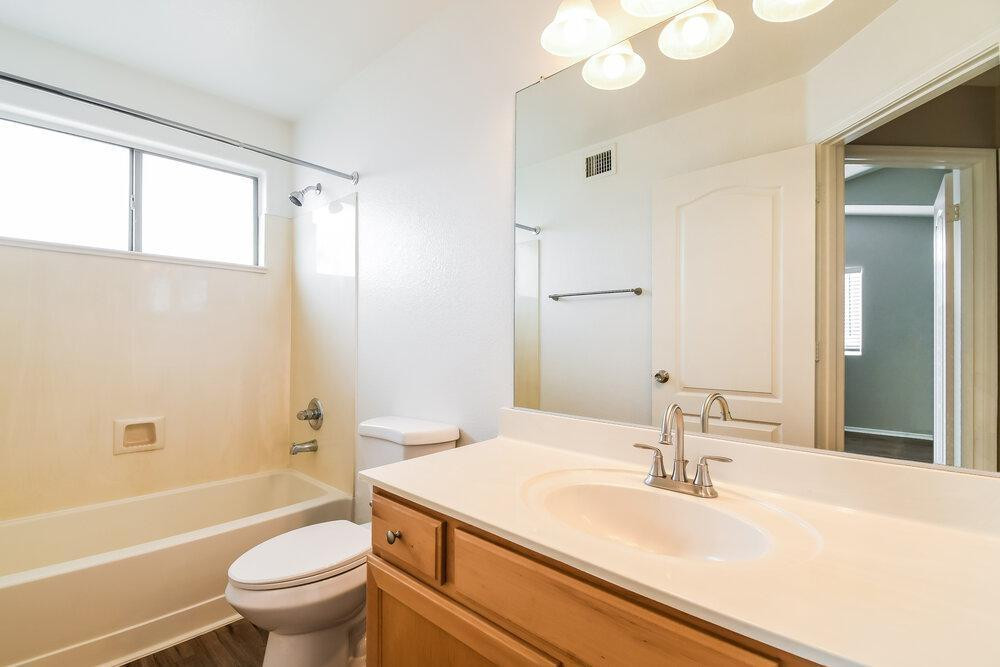 1766 East Tyson Street Gilbert, AZ 85295 - Photo 14 of 17 a bathroom with a granite countertop sink toilet and shower