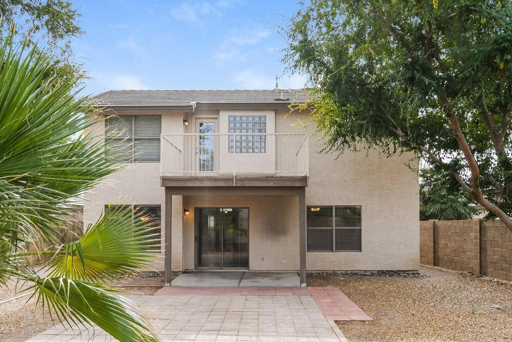 1766 East Tyson Street Gilbert, AZ 85295 - Photo 17 of 17 a front view of a house with a garden