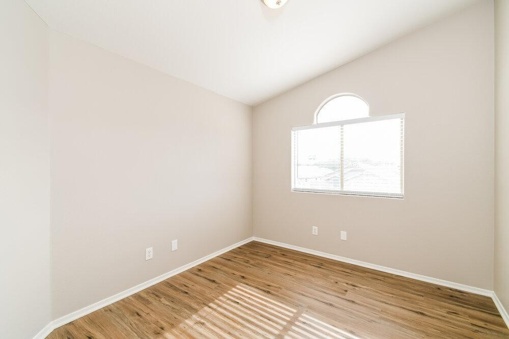1766 East Tyson Street Gilbert, AZ 85295 - Photo 6 of 17 an empty room with wooden floor and windows
