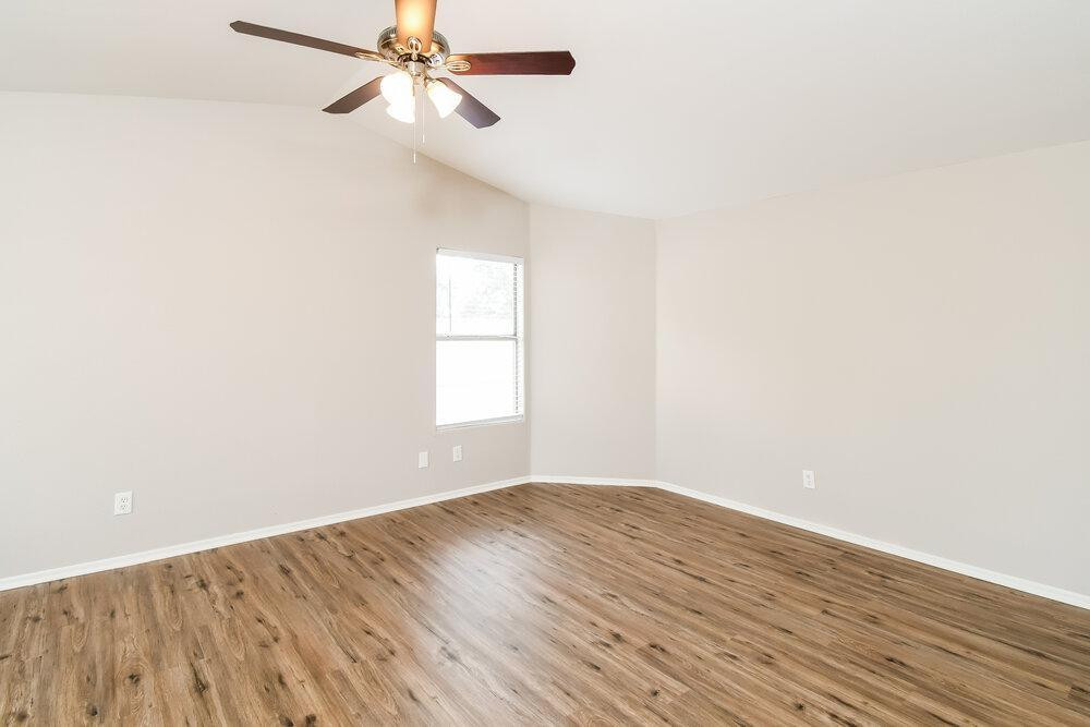 1766 East Tyson Street Gilbert, AZ 85295 - Photo 9 of 17 a view of empty room with wooden floor and fan