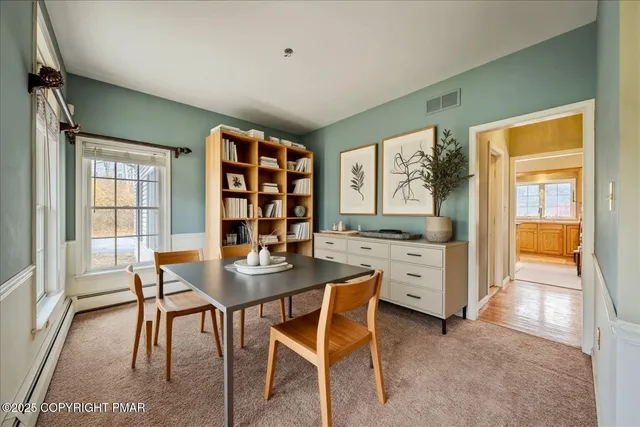 a view of a hallway to a room with stair