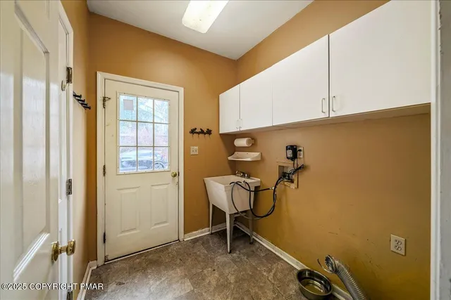 a bathroom with a granite countertop toilet sink and mirror