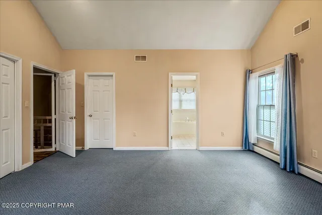 a spacious bathroom with a tub sink shower and mirror
