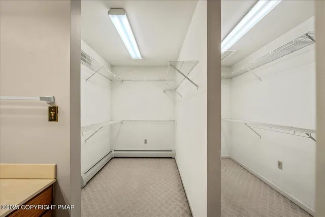 a bathroom with a sink a toilet a mirror and vanity