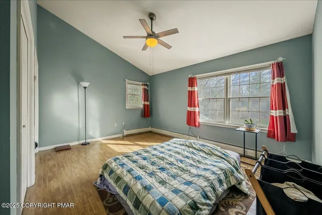 a bedroom with a bed and a mirror