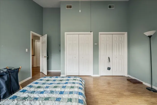 a bathroom with a double vanity sink a mirror and a shower