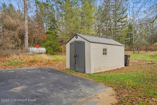 an aerial view of a house with yard swimming pool and outdoor seating