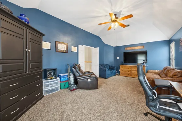 a bedroom with furniture and window
