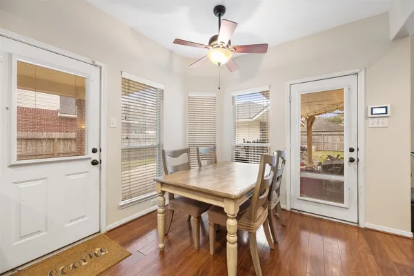 a view of a dining room with furniture window and wooden floor