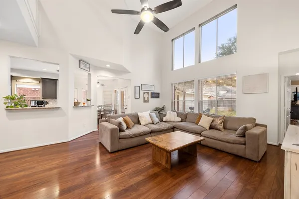 a living room with furniture or kitchen and a wooden floor