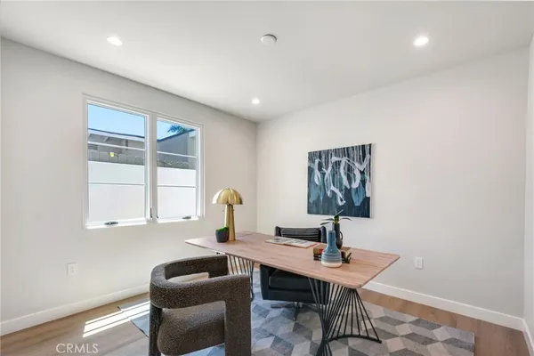 a workspace with furniture and window