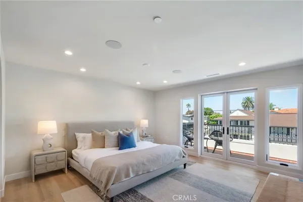 a bedroom with a large bed and a tv