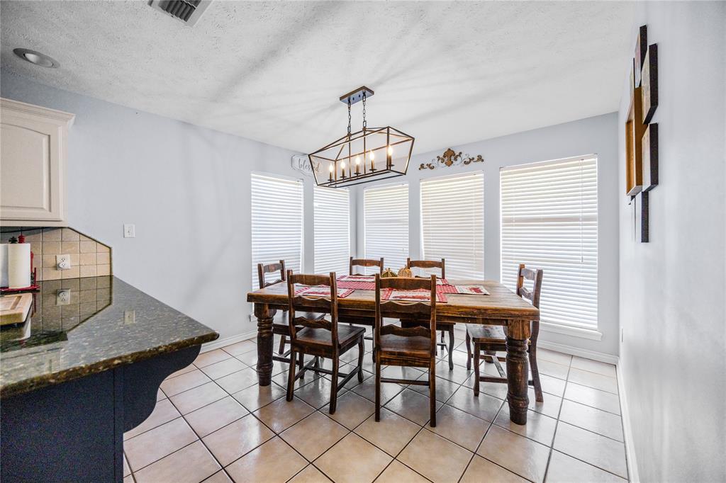 2895 County Road 118 Overton, TX 75684 - Photo 13 of 40 a view of a dining room with furniture window and wooden floor