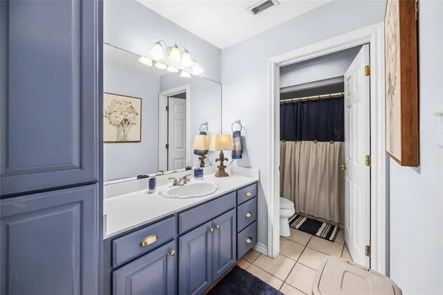 a bathroom with a sink a mirror and a shower