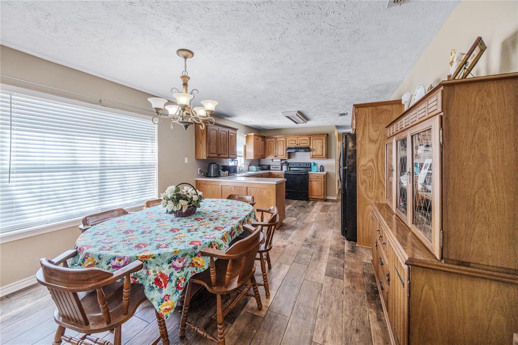 2895 County Road 118 Overton, TX 75684 - Photo 22 of 40 a view of a dining room with furniture and window