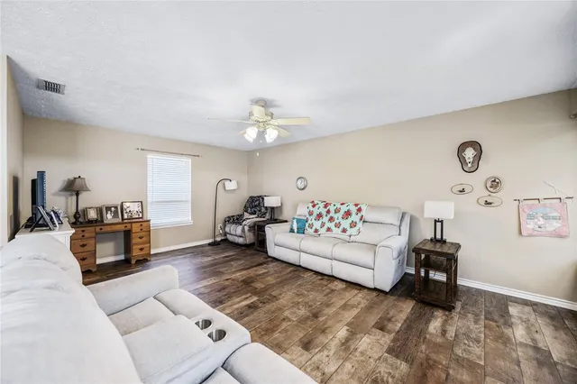 a living room with furniture and a table