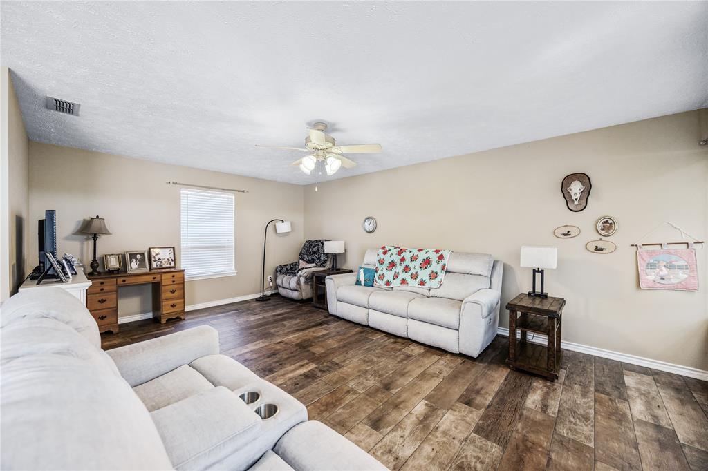 2895 County Road 118 Overton, TX 75684 - Photo 24 of 40 a living room with furniture and a table