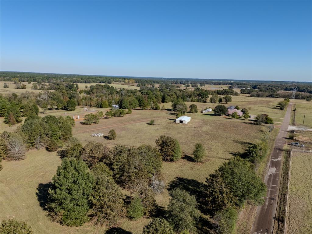 2895 County Road 118 Overton, TX 75684 - Photo 5 of 40 an aerial view of a houses with a lake