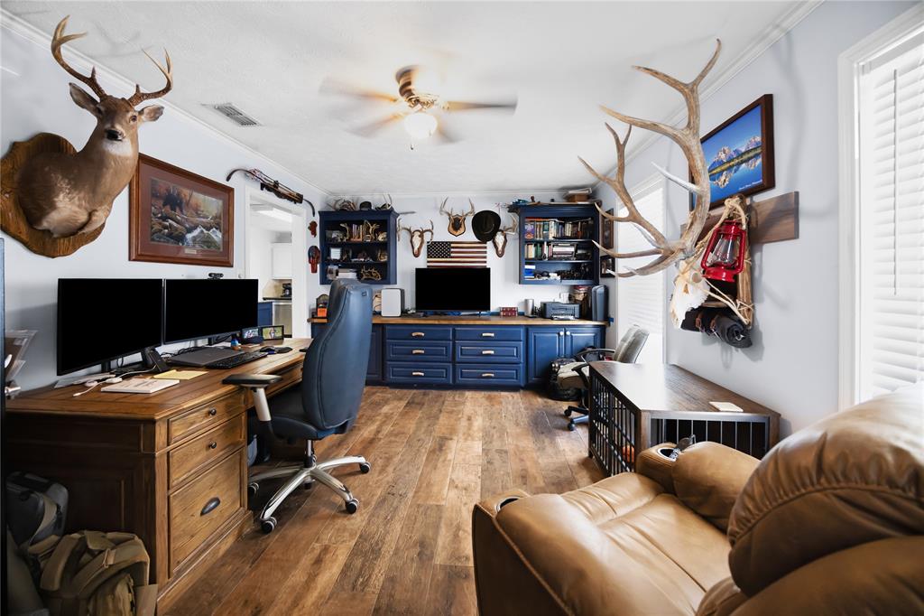 2895 County Road 118 Overton, TX 75684 - Photo 8 of 40 a view of a livingroom with workspace and a couch
