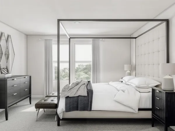 a room with a bed and a window