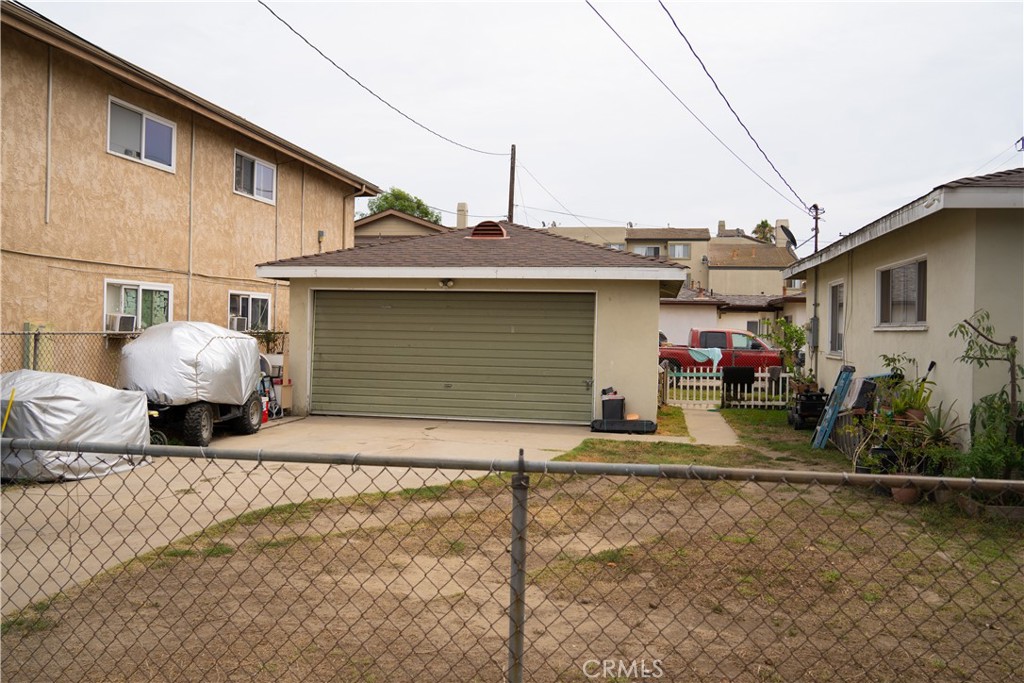 7913 Howe Street Paramount, CA 90723 - Photo 5 of 5 a front view of a house with garden