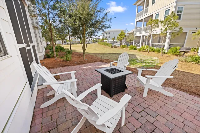 a living room with fireplace furniture and a flat screen tv