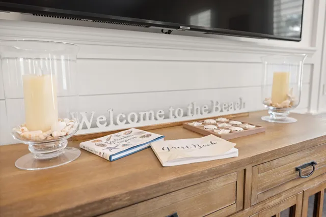 a bedroom with a bed a ceiling fan and a dresser