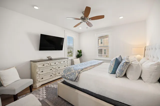 a bathroom with a double vanity sink double mirror and bathtub