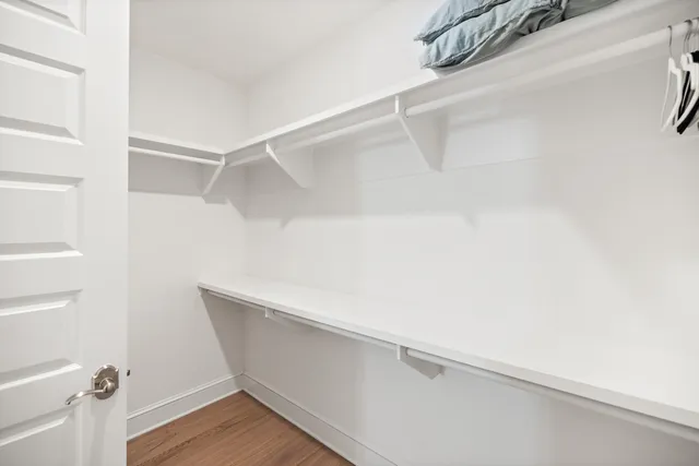 a view of a balcony with wooden floor