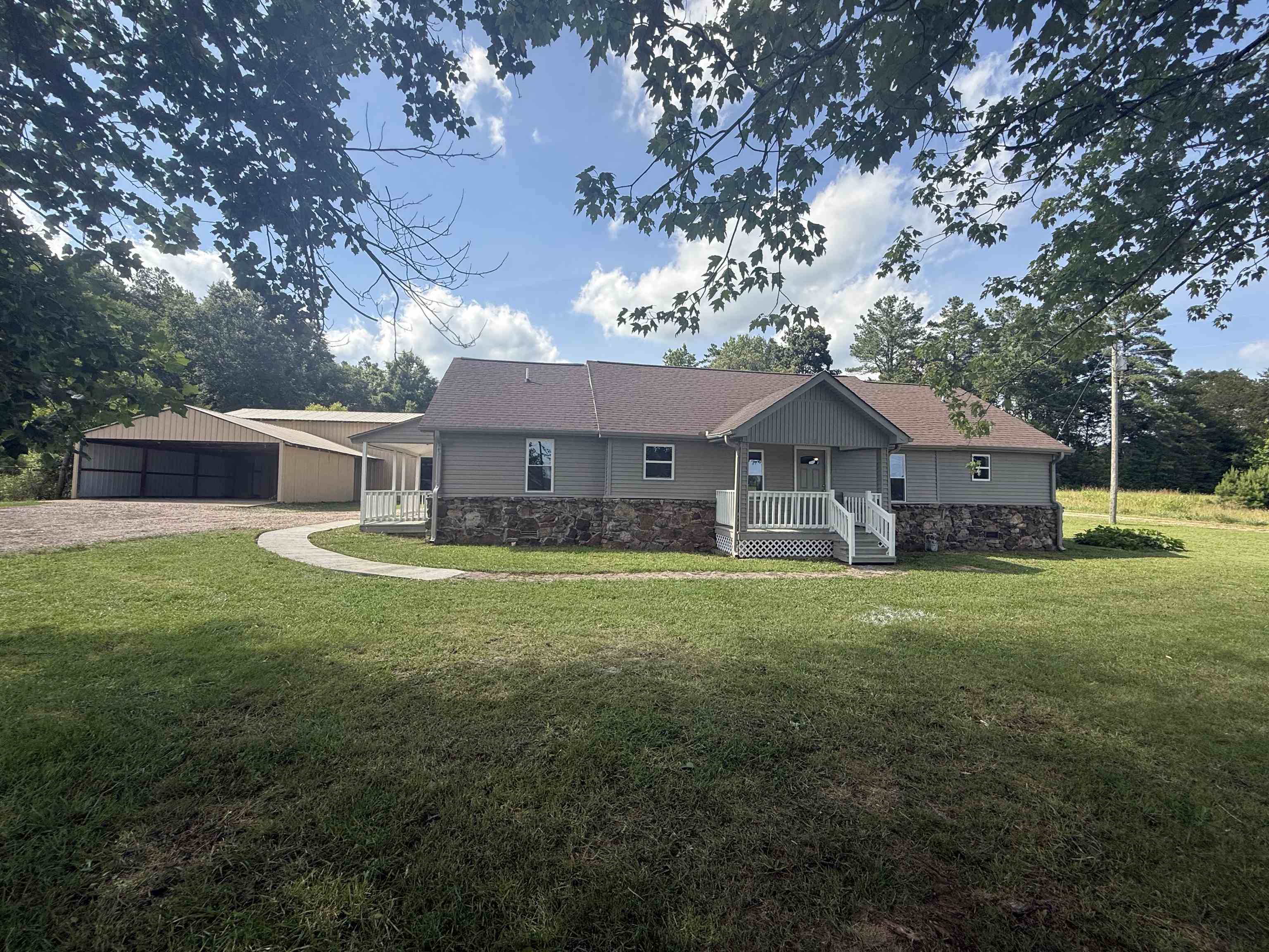 170 Leapwood Road Enville, TN 38332 - Photo 1 of 33 Ranch-style residence featuring a combination of siding and stone veneer