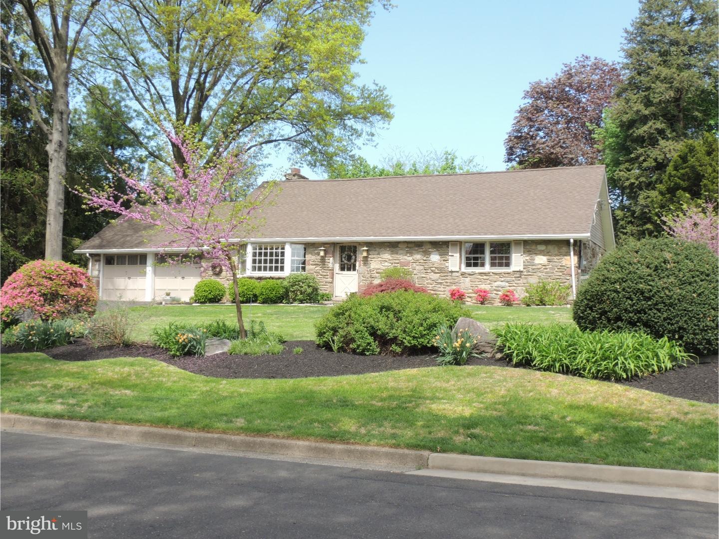 2380 Steven Road Huntingdon Valley, PA 19006 - Photo 1 of 24 a front view of a house with a yard and potted plants
