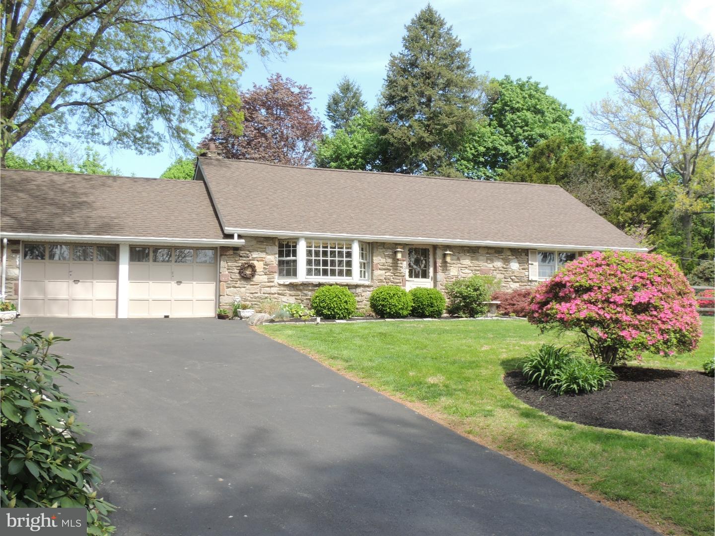 2380 Steven Road Huntingdon Valley, PA 19006 - Photo 2 of 24 a front view of a house with a yard and garage
