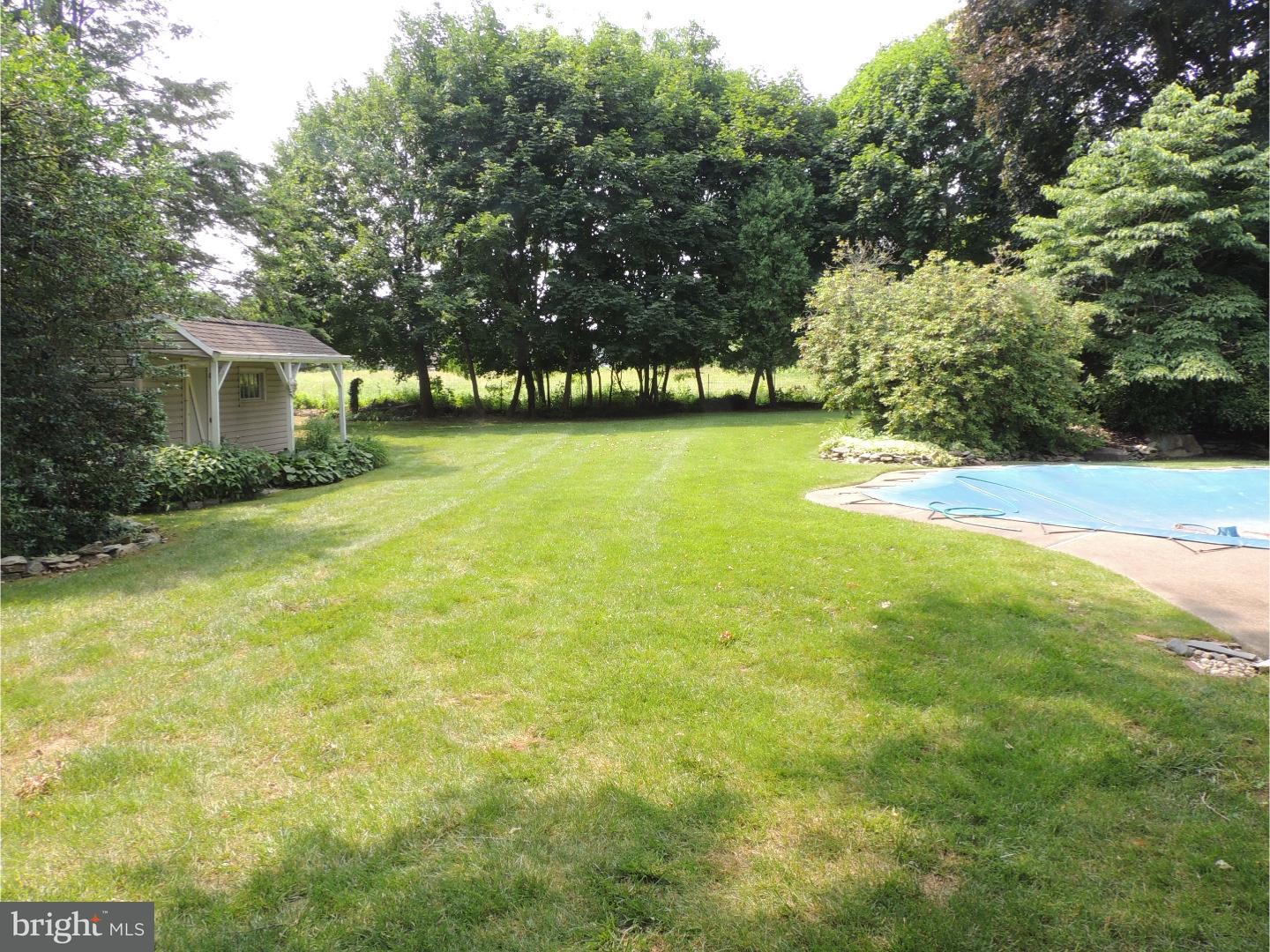 2380 Steven Road Huntingdon Valley, PA 19006 - Photo 21 of 24 a view of a yard with a house in the background