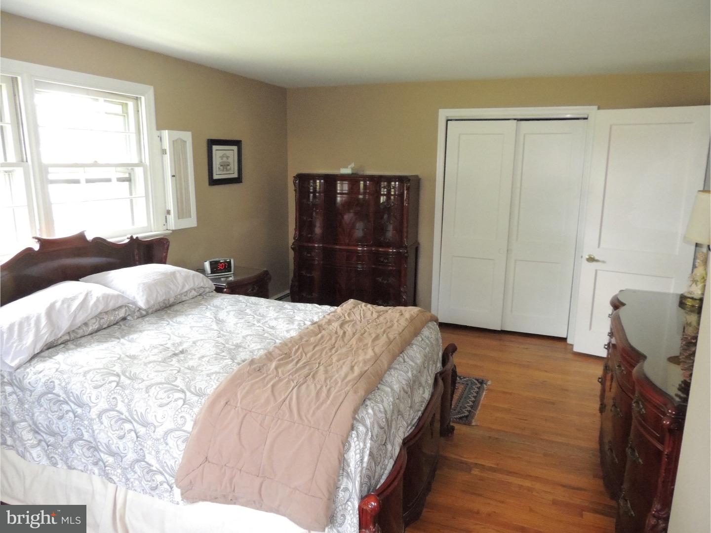 2380 Steven Road Huntingdon Valley, PA 19006 - Photo 10 of 24 a bedroom with a bed and a window