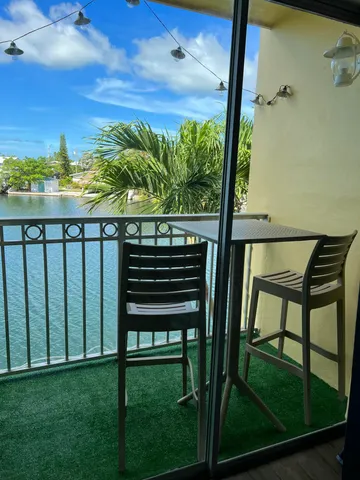 a view of a balcony with furniture