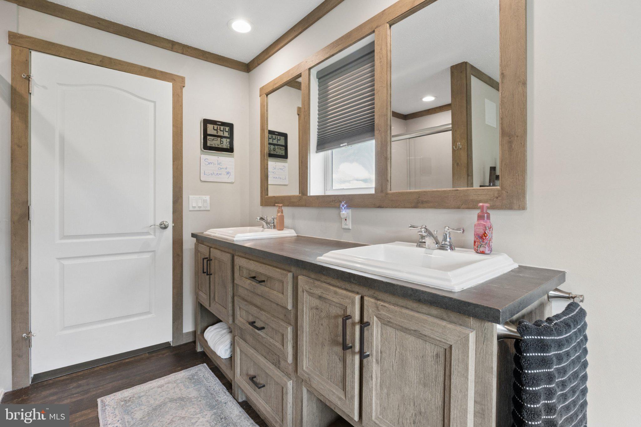 464 Sandtown Road Felton, DE 19943 - Photo 18 of 40 Modern dual-sink bathroom oasis.