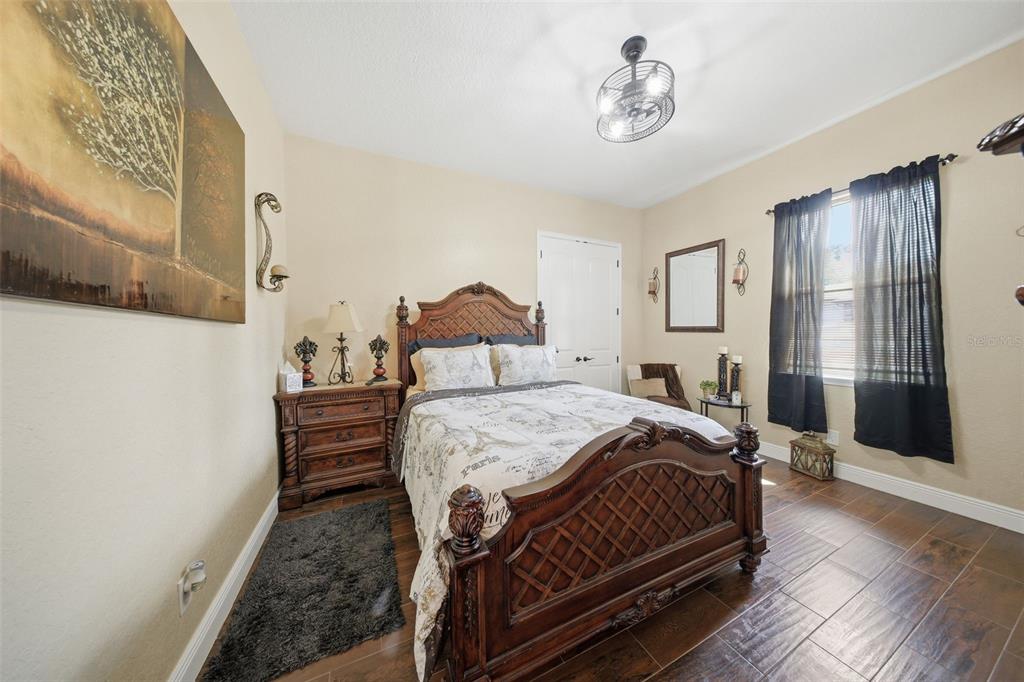 13429 Montevista Road Clermont, FL 34711 - Photo 49 of 89 a bedroom with a bed and wooden floor