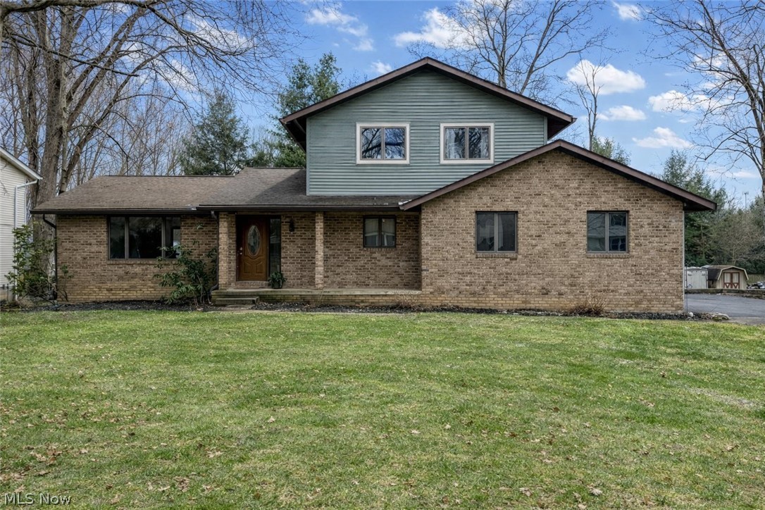 2412 Audubon Road Akron, OH 44320 - Photo 1 of 1 Front of home. AI edited to remove snow and brighten sky.