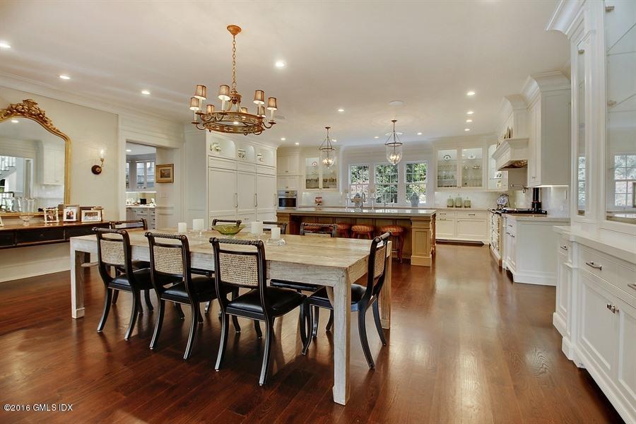 3 Parsonage Lane Greenwich, CT 06830 - Photo 17 of 38 a large kitchen with a table and chairs