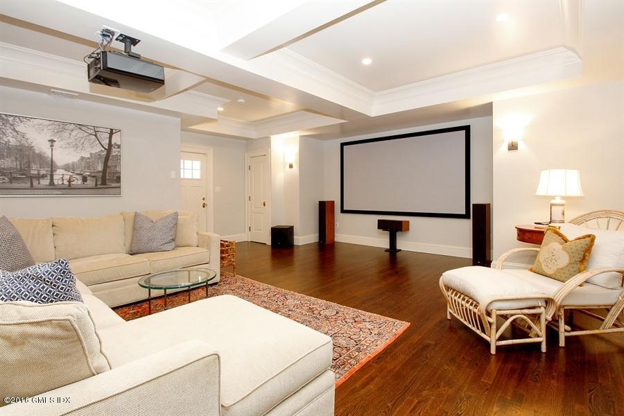 3 Parsonage Lane Greenwich, CT 06830 - Photo 28 of 38 a living room with furniture and a flat screen tv