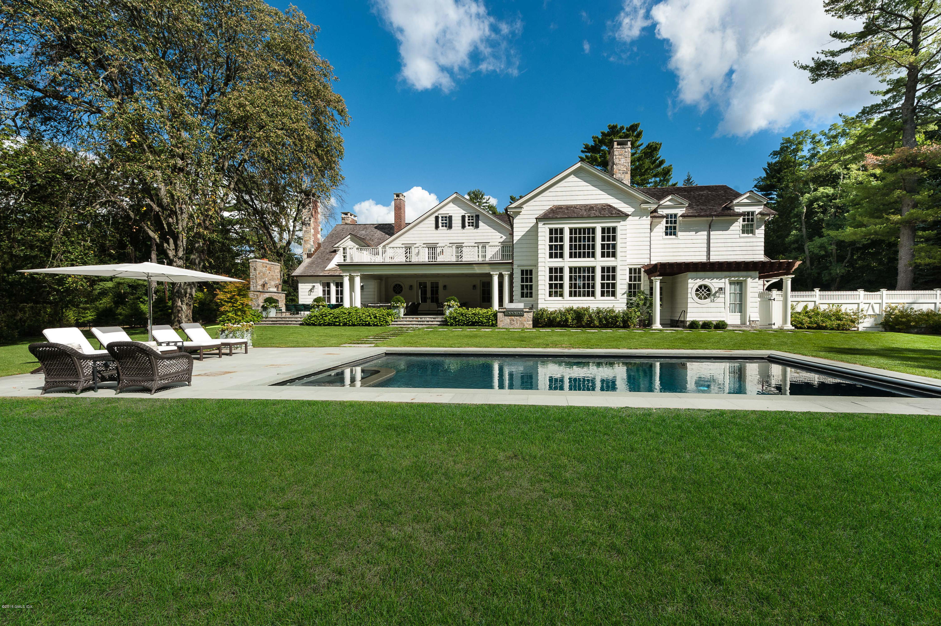 3 Parsonage Lane Greenwich, CT 06830 - Photo 5 of 38 a view of a house with a swimming pool