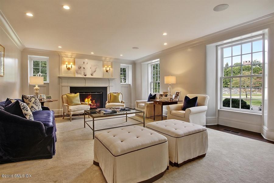 3 Parsonage Lane Greenwich, CT 06830 - Photo 9 of 38 a living room with furniture and a fireplace