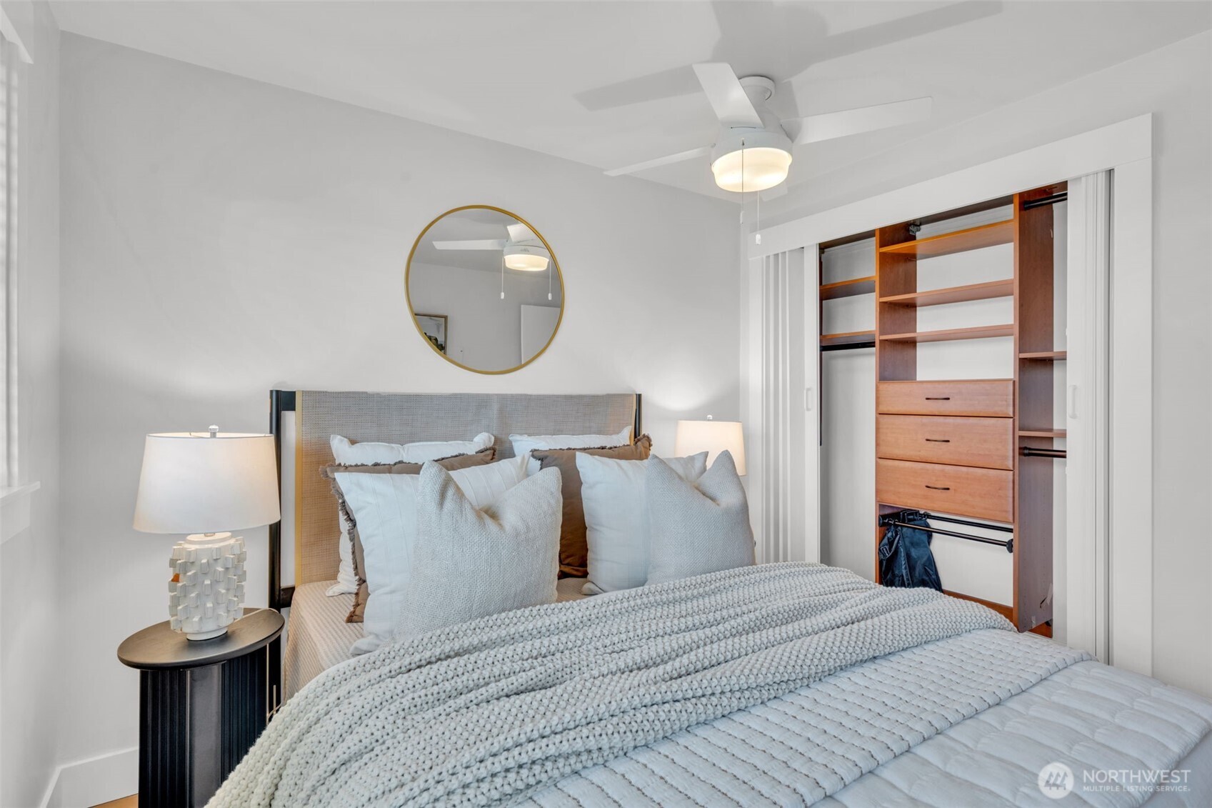 3401 Wallingford Avenue North, Unit 405 Seattle, WA 98103 - Photo 18 of 28 a bed room with a bed and a night stand