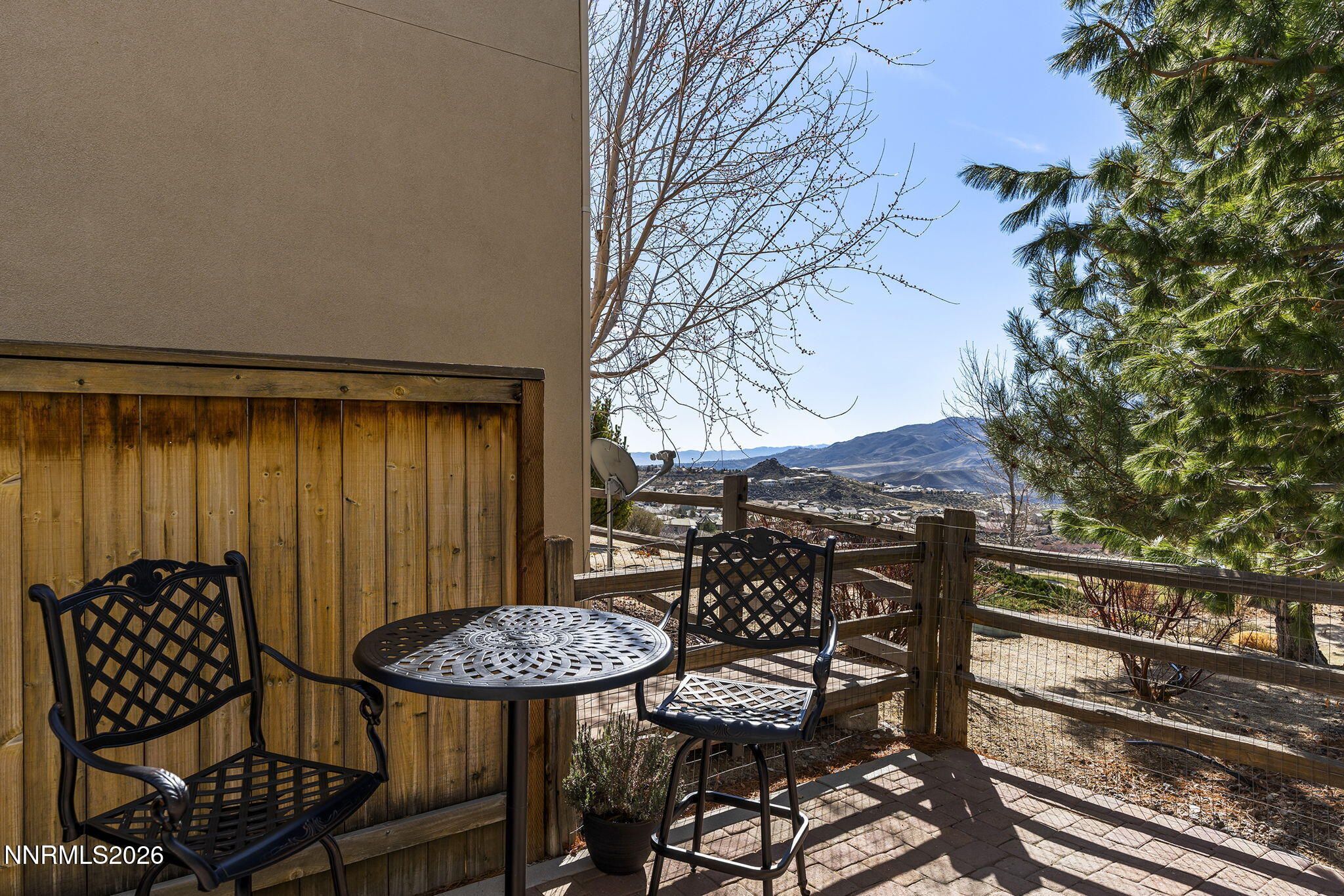 2220 Heavenly View Trail Reno, NV 89523 - Photo 25 of 29 a view of a patio with table and chairs with wooden floor and fence
